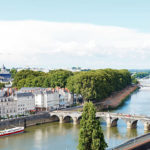Angers, France - July 28, 2014: Monge Quai, bridges Pont de Verdun and Pont de Haute Chaine on La Maine river in Angers, France. Angers is city is the historical capital of the province of Anjou